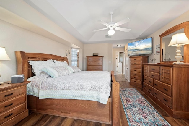 bedroom with ceiling fan and dark wood-type flooring