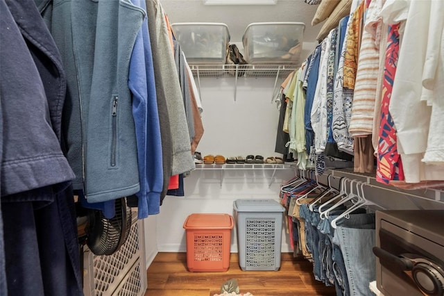 spacious closet featuring dark wood-type flooring