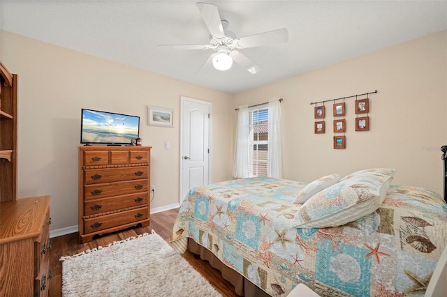 bedroom featuring ceiling fan and dark hardwood / wood-style flooring