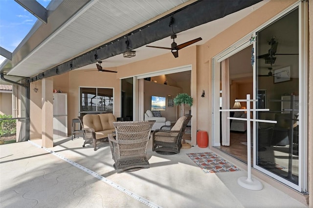 view of patio / terrace featuring ceiling fan