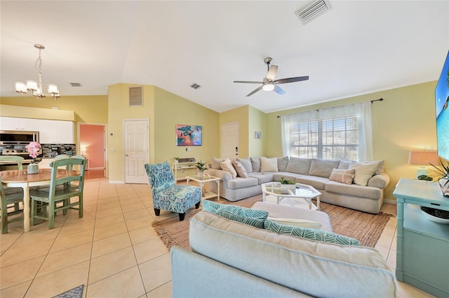 living room with light tile patterned floors, ceiling fan with notable chandelier, and lofted ceiling