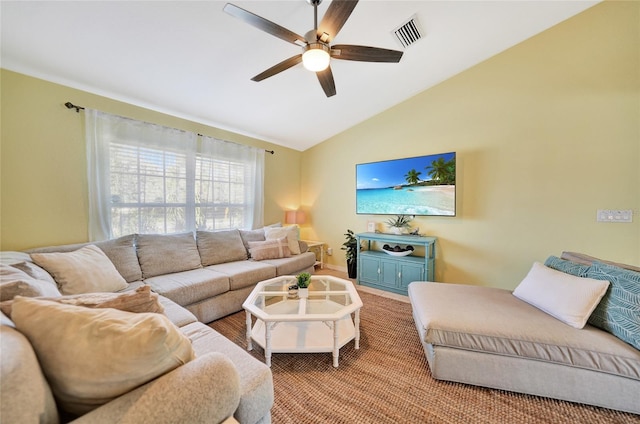 living room featuring carpet flooring, ceiling fan, and lofted ceiling