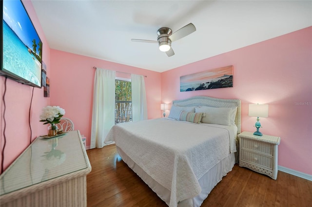 bedroom featuring ceiling fan and dark hardwood / wood-style flooring