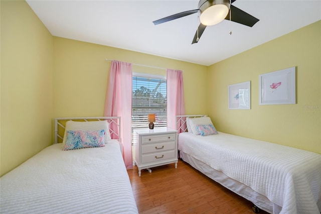 bedroom featuring ceiling fan and hardwood / wood-style flooring