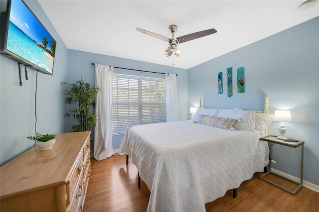 bedroom featuring ceiling fan and hardwood / wood-style floors