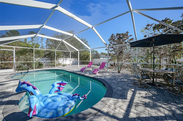 view of pool featuring a lanai and a patio area