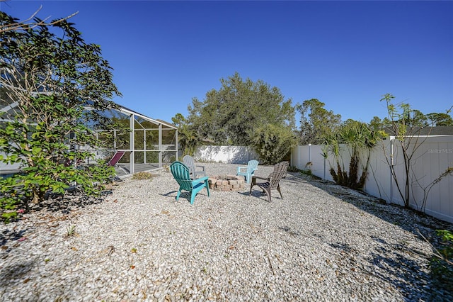 view of yard featuring a fire pit and a patio