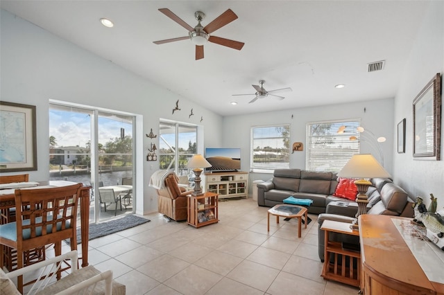 tiled living room with ceiling fan