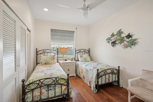 bedroom with ceiling fan, a closet, and hardwood / wood-style flooring