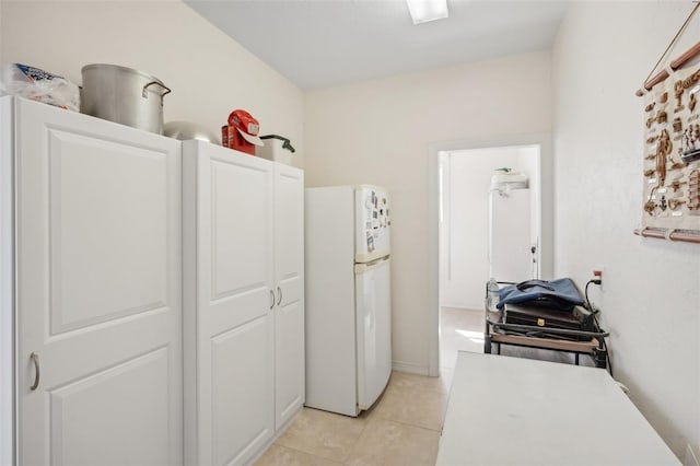 laundry room with light tile patterned flooring