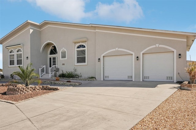 view of front of property with a garage