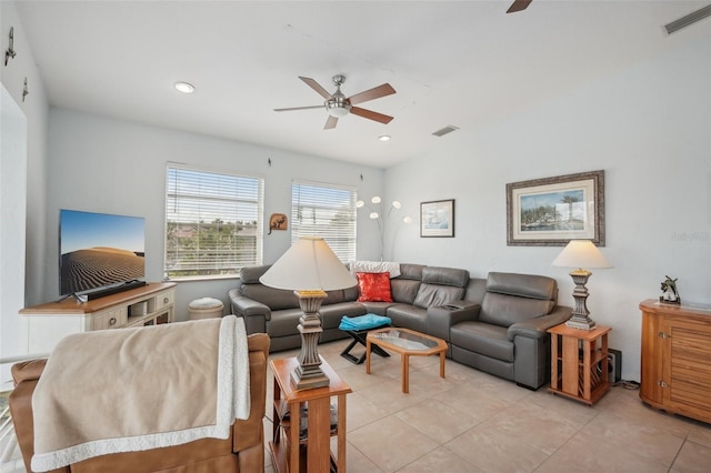 living room with ceiling fan and light tile patterned flooring