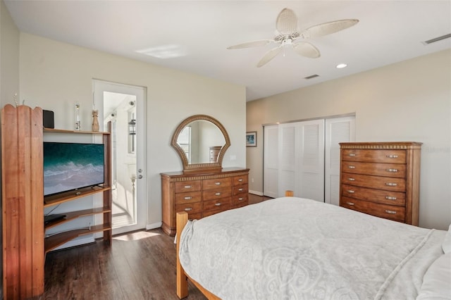 bedroom with ceiling fan, a closet, and dark hardwood / wood-style floors