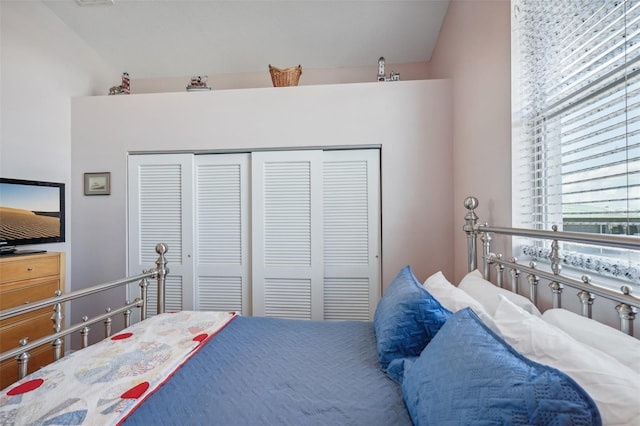 bedroom with a closet and vaulted ceiling