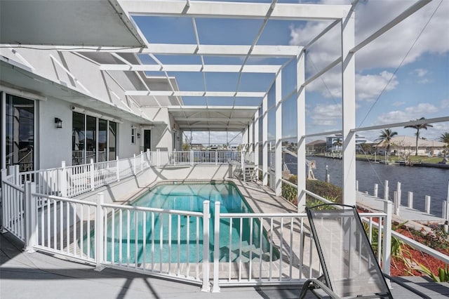 view of pool featuring a water view and a patio