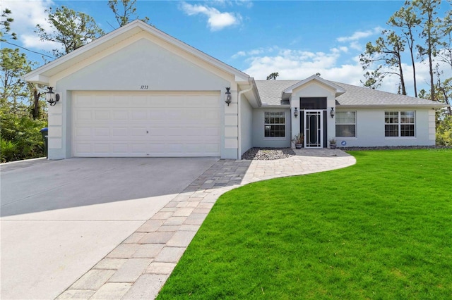 ranch-style home with a front yard and a garage