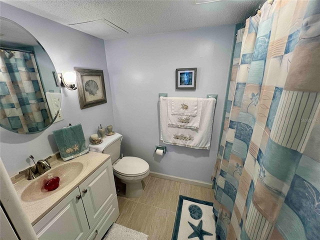 bathroom featuring vanity, toilet, a textured ceiling, and hardwood / wood-style floors