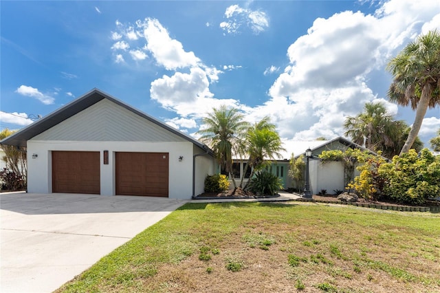 single story home with a front lawn and a garage