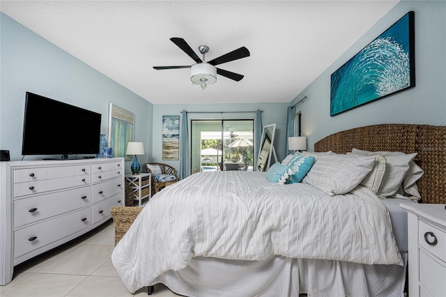 tiled bedroom with access to outside and ceiling fan