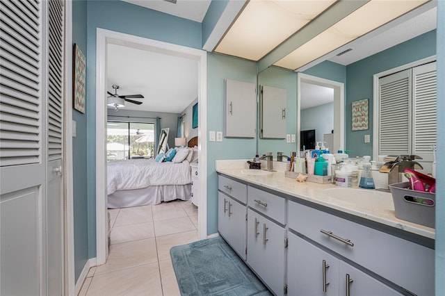 bathroom featuring vanity, ceiling fan, and tile patterned floors