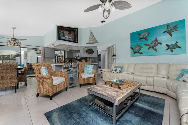 tiled living room featuring lofted ceiling and ceiling fan