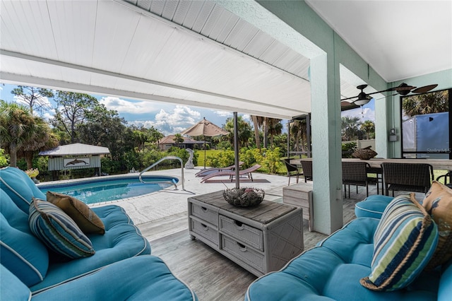 exterior space featuring ceiling fan and an outdoor hangout area