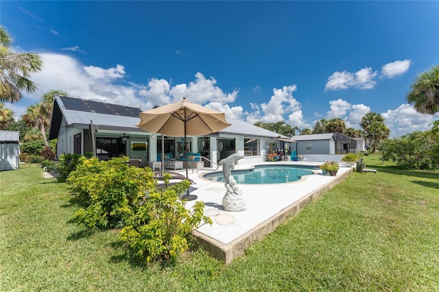 rear view of property with a patio and a yard