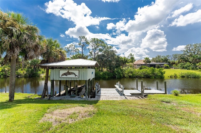 dock area with a water view and a lawn