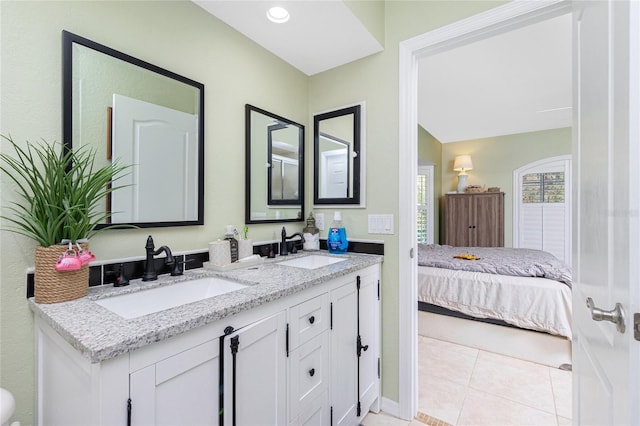 bathroom with vanity and tile patterned flooring