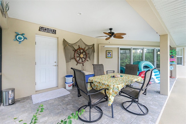 dining space featuring ceiling fan