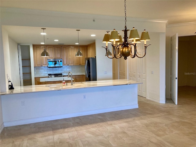 kitchen with tasteful backsplash, stainless steel appliances, a notable chandelier, hanging light fixtures, and kitchen peninsula