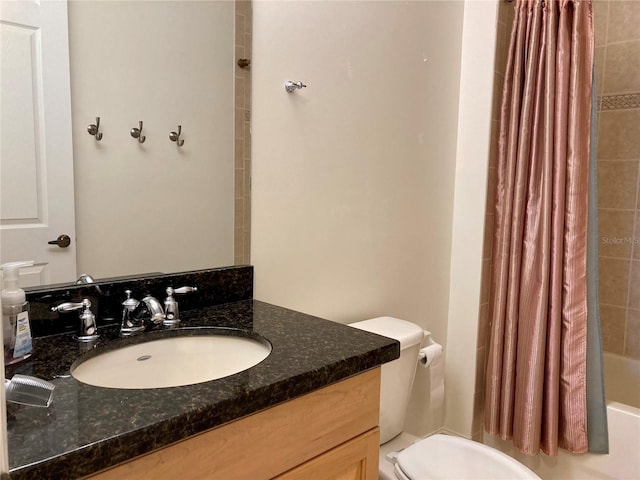 full bathroom featuring vanity, toilet, and shower / bath combination with curtain