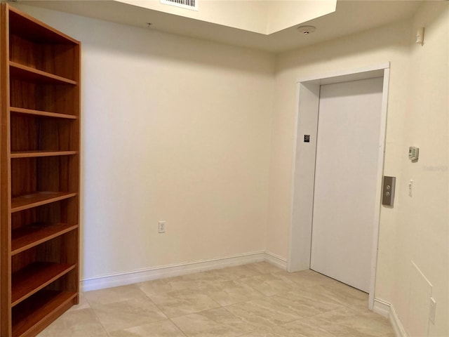 spare room with elevator