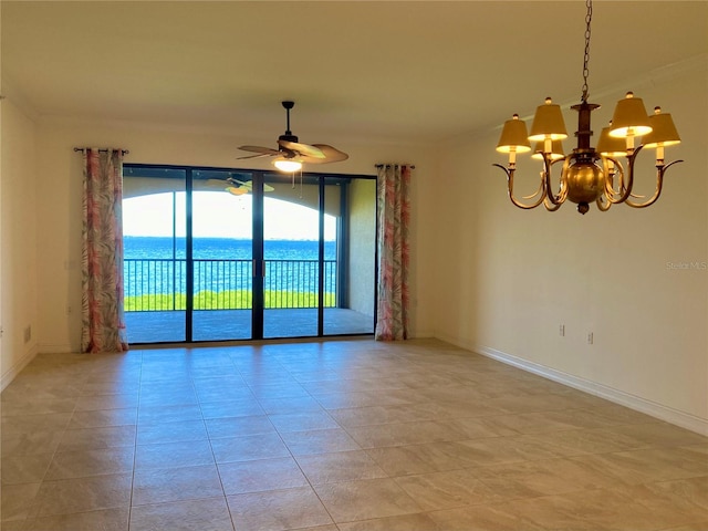 tiled spare room featuring ceiling fan with notable chandelier and a water view