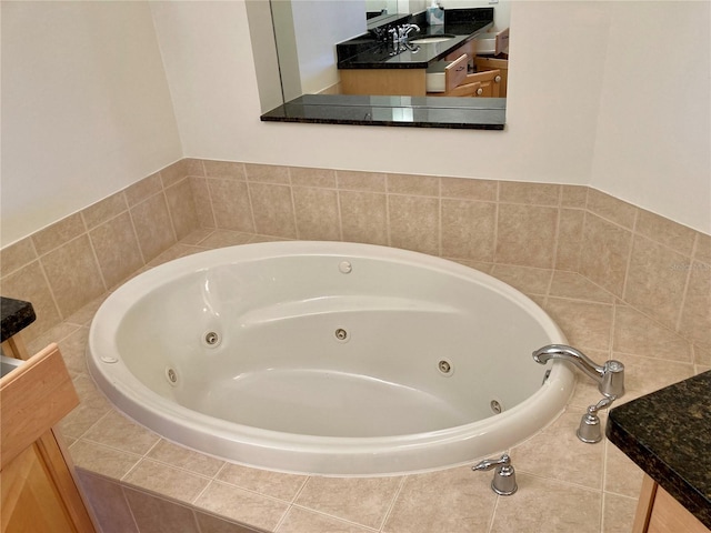 bathroom featuring tiled bath and sink