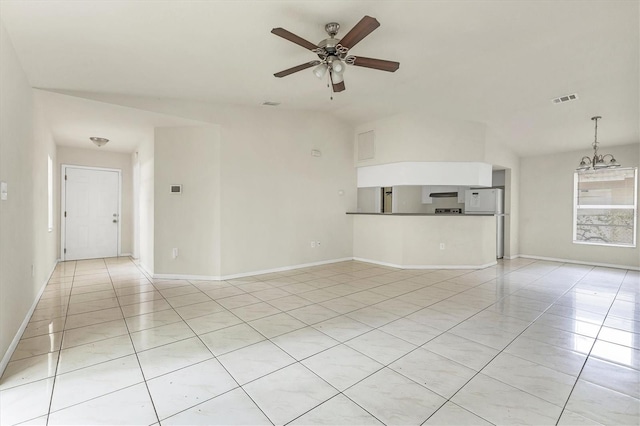 unfurnished living room featuring ceiling fan, light tile patterned floors, and vaulted ceiling