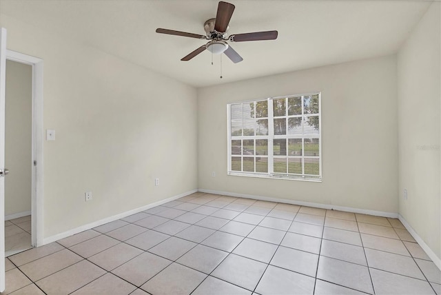 tiled empty room with ceiling fan