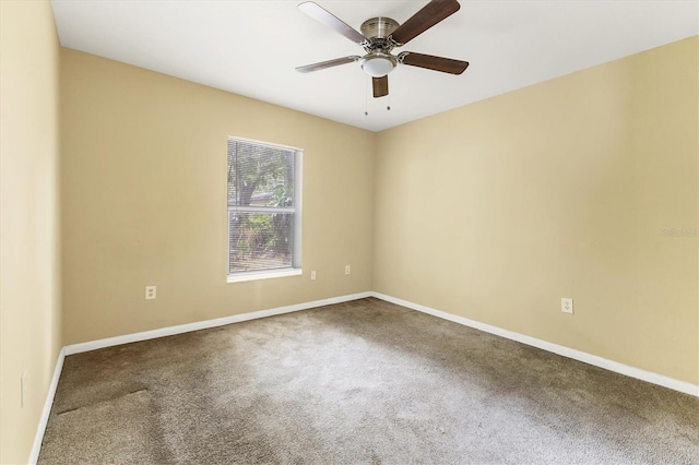 spare room featuring ceiling fan and carpet floors