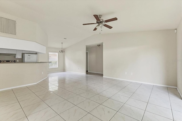 tiled spare room with ceiling fan with notable chandelier and vaulted ceiling