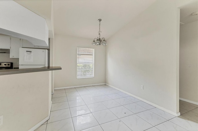 unfurnished dining area with a chandelier and light tile patterned floors