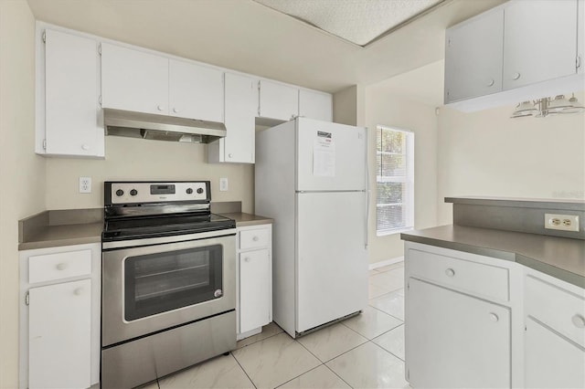 kitchen featuring stainless steel range with electric stovetop, white fridge, white cabinets, and a textured ceiling