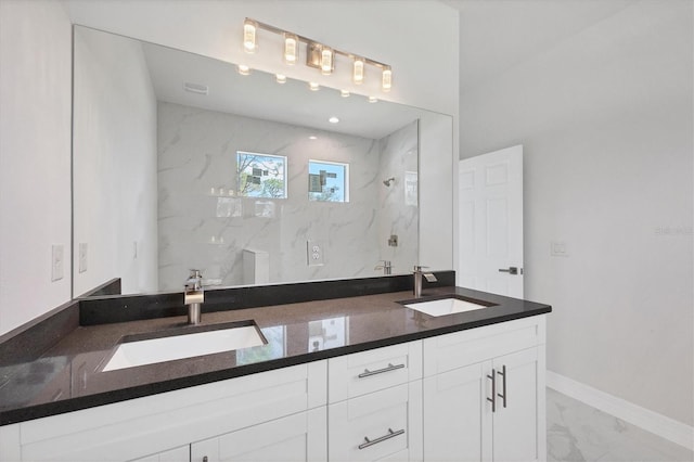 bathroom featuring vanity and a tile shower