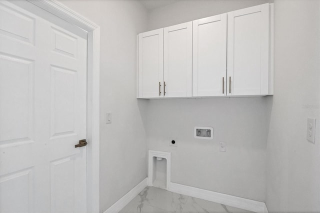 clothes washing area featuring electric dryer hookup, washer hookup, and cabinets