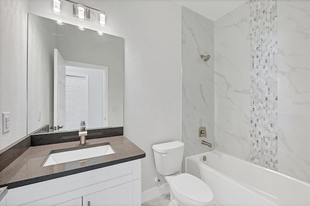 full bathroom featuring tiled shower / bath, vanity, and toilet