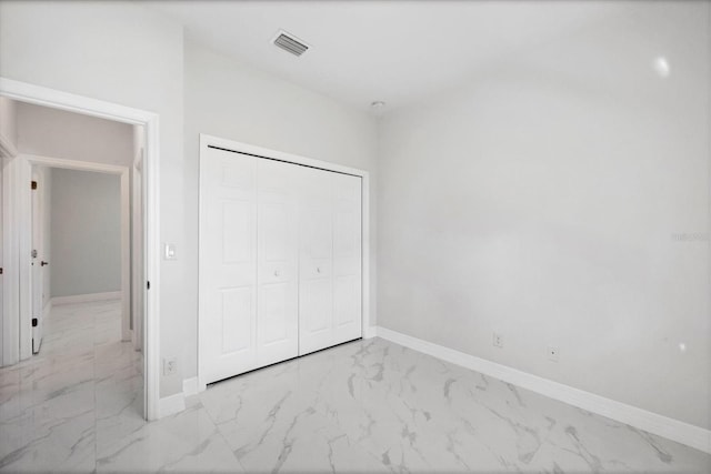 unfurnished bedroom featuring a closet