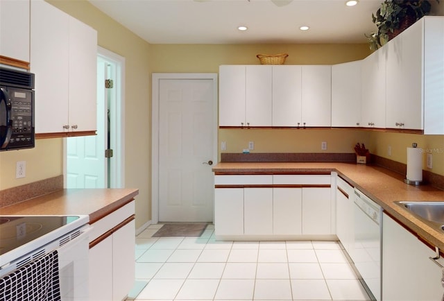 kitchen with white cabinetry, white dishwasher, and light tile patterned floors