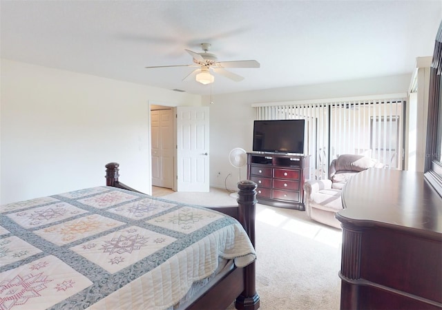 bedroom with light carpet and ceiling fan