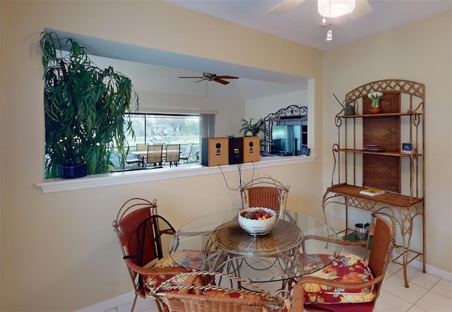 dining room featuring tile patterned flooring and ceiling fan