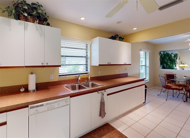 kitchen featuring sink, light tile patterned flooring, dishwasher, white cabinetry, and ceiling fan