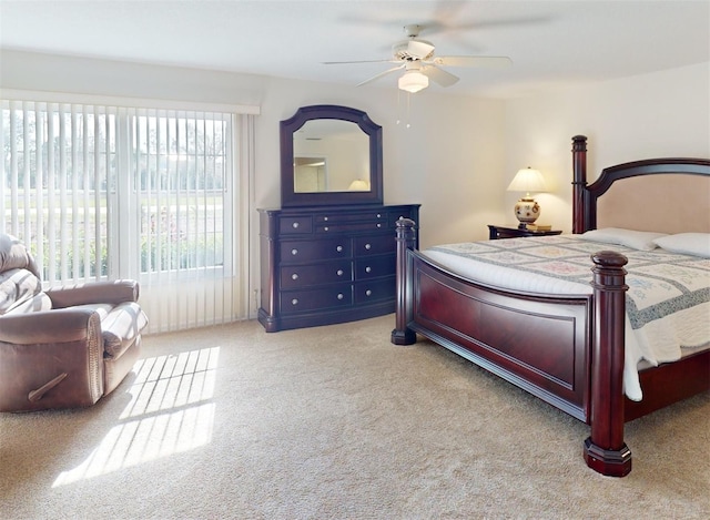 bedroom with ceiling fan and light colored carpet